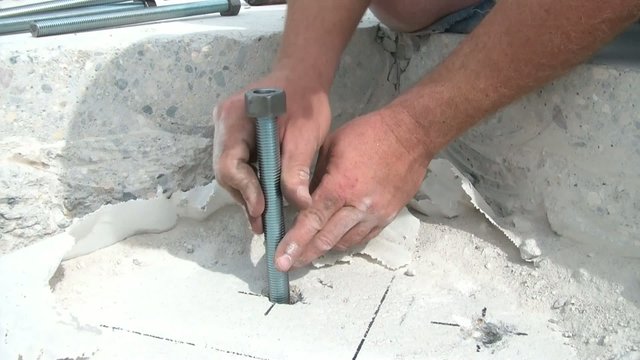 Screwing Bolt Anchor with Construction Glue into Hole