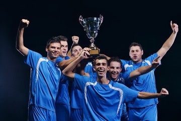 soccer players celebrating victory