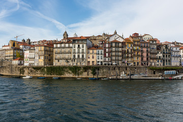 Obraz premium View of Porto city at the riverbank (Ribeira quarter) and wine b
