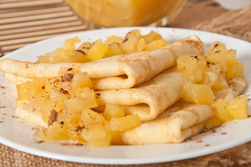 Sweet crepes with apple caramel and cream 