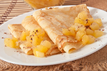 Sweet crepes with apple caramel and cream 