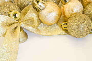 Golden Christmas baubles, stars, bell and ribbon