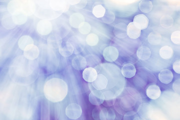 Blue spotted background with rays of light