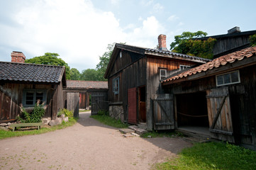 Fototapeta na wymiar Medieval wooden houses and a yard