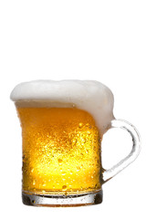 Mug fresh beer with cap of foam isolated on white background