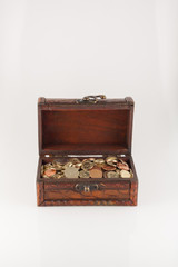 front view of the box with coins on white
