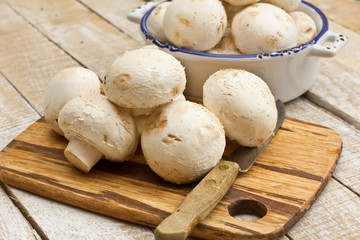 Fresh mushrooms on wooden board