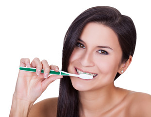 Beautiful woman brushing her teeth