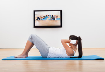 Athletic woman working out at home