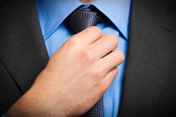 Businessman adjusting his look