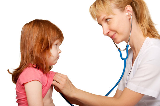 Doctor pediatrician listening to the child's heart.