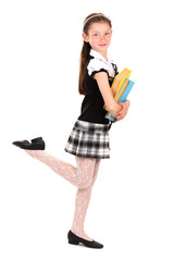 beautiful little girl in school uniform with books isolated
