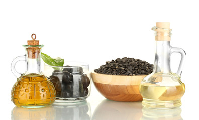 Olive and sunflower oil in the small decanters isolated on