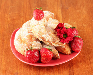 Fresh bagels with strawberry in the plate