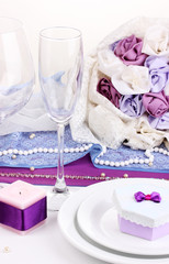 Serving fabulous wedding table in purple color isolated on