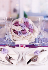 Serving fabulous wedding table in purple color of the