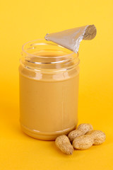Delicious peanut butter in open jar of peanut near