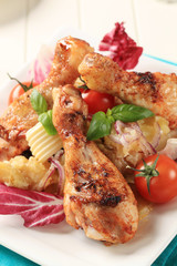 Spicy roast chicken drumsticks with potato salad