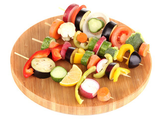 Sliced vegetables on wooden picks isolated on white