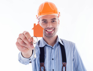 A builder man holding a key and a paper house.