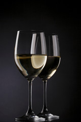 white wine glass silhouette black background