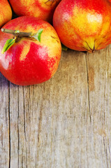 pomegranates on a wooden background