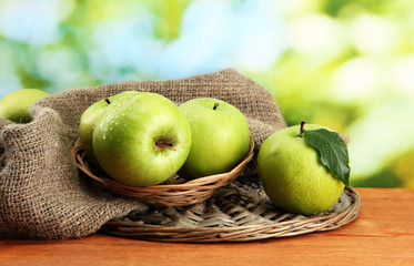 Ripe green apples in basket