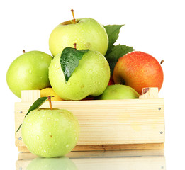 sweet apples in wooden crate, isolated on white