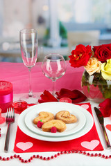 Table setting in honor of Valentine's Day on room background