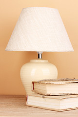 table lamp and books on beige background