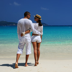 Couple in white on a beach