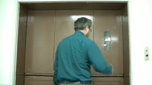 Man Opening Elevator Doors