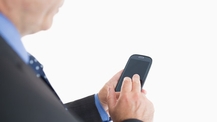 Businessman texting with smartphone