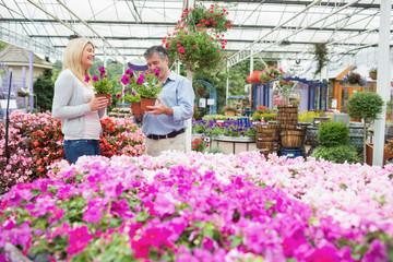 Couple choosing flowers in the garden centre