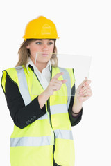 Female architect pressing something on a pane