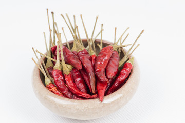 Red pepper in bowl on white background