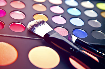 multi colored make-up and brush