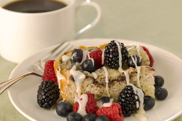 Dessert cake with fresh berries and black coffee