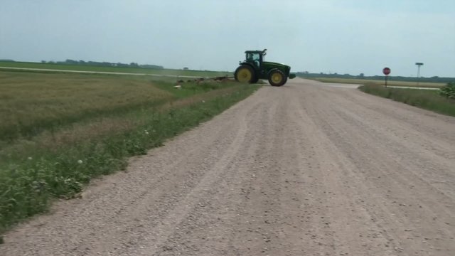 Tractor Crossing Dirt Road