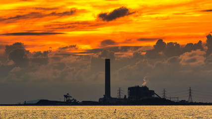 Power plant on sunset