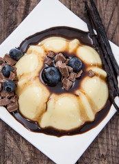 Portion of Vanilla Pudding with sauce
