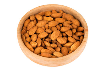 Raw almonds in wooden bowl isolated on white (clipping path)