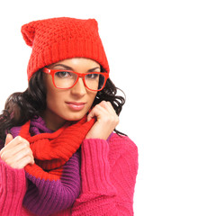 Portrait of a young woman in red clothes and stylish glasses