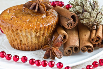 Homemade muffin  with cinnamon and anise on plate.