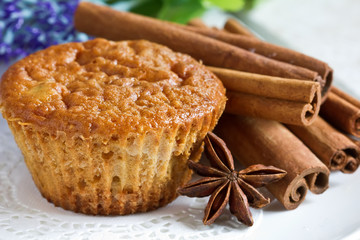 Fototapeta na wymiar Homemade muffins with cinnamon and anise on plate.