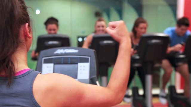 Woman teaching spinning class