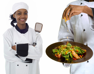 Chef sprinking cheese on salad