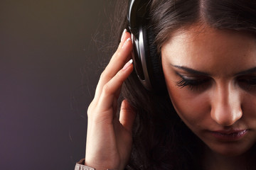 beautiful brunette in headphones