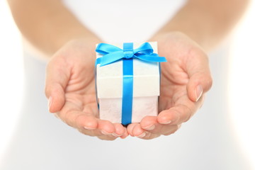Gift box in female hands