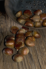 roasting chestnut in a typical italian pan